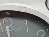 a close up of a clock that is on a table