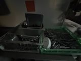 a dishwasher with a lot of dishes inside of it