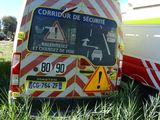 a van that is sitting in the grass with a sign on it
