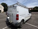a white van that is parked in a parking lot