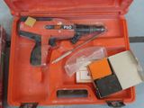 a tool in a case that is sitting on the floor