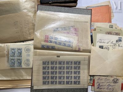 a pile of old letters and envelopes sitting on a table