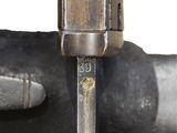 a close up of a metal object on a white surface