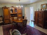 an image of a living room with a couch and a dining room table