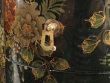 a close up of a black box with flowers on it
