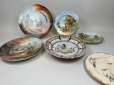 many plates that are sitting on a table