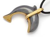 an image of a black and gold necklace with a horn shaped horn