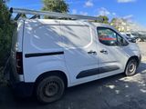 a white van that is parked in the parking lot
