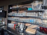 many empty glasses on the shelves in the kitchen
