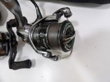 a close up of a fishing reel on a table