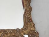 a mirror that is sitting on the wall in the room