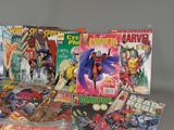 several comic books are sitting on a table with a gray background