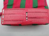 a pink and green striped bag with a red tag on it