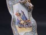 a plate with a picture of a man and a woman on it