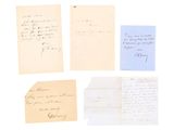 a group of old letters and papers on a white surface