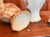 two vases that are sitting on a table