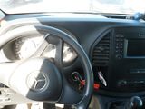 dashboard of a car with a steering wheel and dashboard controls