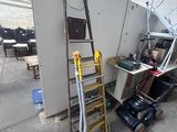 a ladder leaning against a wall in a garage