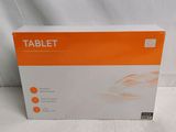 the box of the tablet is sitting on a white surface