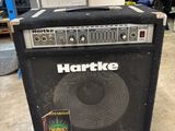 a black amp sitting on the floor in a room