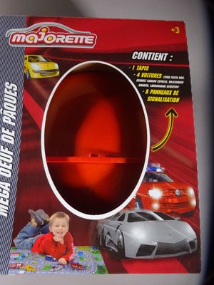 a box with a toy car inside of it