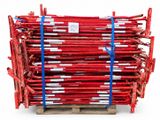 a stack of red scaffoldings on a wooden pallet