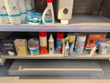 a lot of cleaning products on a shelf in a store