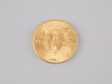 an image of a gold coin sitting on top of a white surface