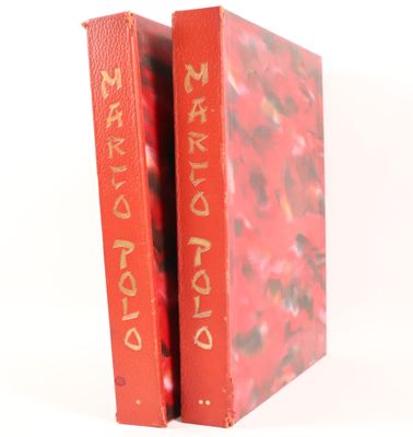a red book with gold writing on the cover