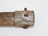 an old hammer that is on a white surface