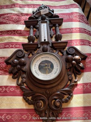 a clock that is on the wall on the bed