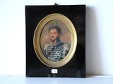 portrait of a man in a striped shirt in a black frame