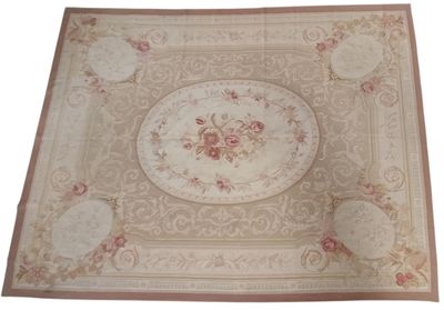 beige area rug with a floral design on a white background