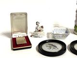 a small collection of miniature figurines sitting on a table