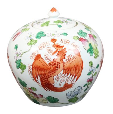 a white vase with a red and orange dragon on it