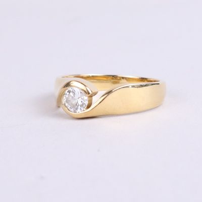 an image of a gold ring with a single diamond