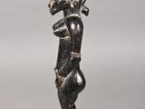 pair of bronze figurines of a man and a woman