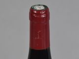 a bottle of wine that is sitting on a table