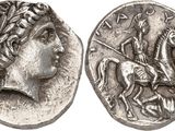 a silver coin with an image of a man riding a horse