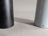 two salt and pepper shakers sitting on a table