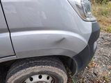 a car that has a flat tire on the side of the road