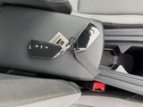 a cell phone that is attached to the seat of a car