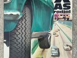 an image of a magazine with a picture of a green car on the cover