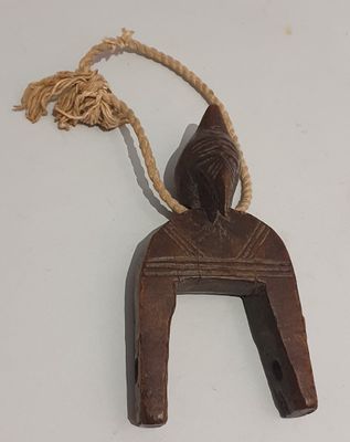 brown wooden horse shoe hanger with rope on white surface