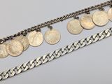 a close up of a row of silver coins on a chain