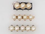 a set of five pairs of pearl hair clips