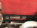 a close up of a machine with a red cover on it
