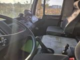 a view of the inside of a truck from the driver ' s seat