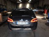 a car that is parked in a garage with a license plate on it