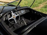 a black sports car with a steering wheel and dashboard